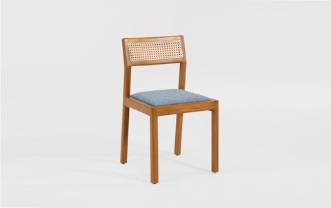 reddie-raw dining chair Rita Rattan Dining Chair