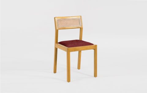 reddie-raw dining chair Rita Rattan Dining Chair